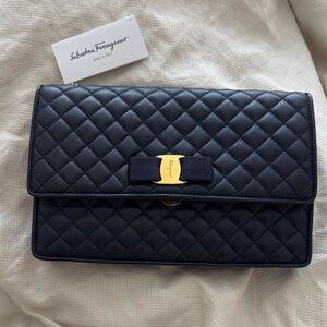 Salvatore Ferragamo Black Quilted Clutch with Gold Bow